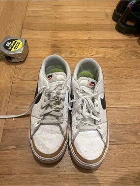 Nike White Low-Top Sneakers with Black Swoosh and Tan Trim